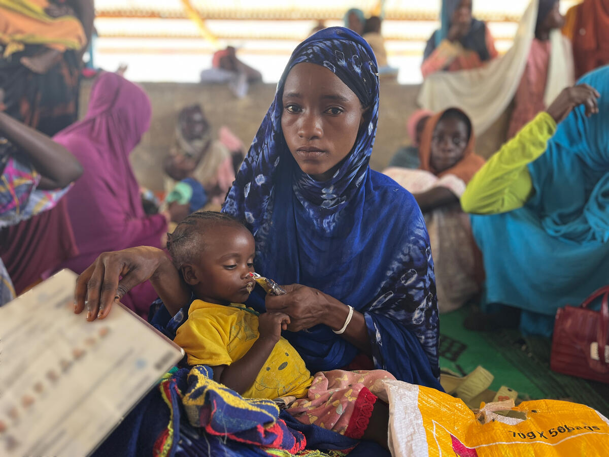 Mowada Moussa Yaya, a 22-year-old mother and Sudanese refugee, is waiting in line for treatment for her malnourished children at the health center that UNHCR, the UN Refugee Agency, is running in Iridimi settlement in Chad. She fled Sudan shortly after the conflict broke out and has been living in Iridimi for about two years. She has already lost one of her children to malnutrition and is now afraid that history will repeat itself.