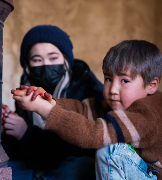 Hadi, 5, now lives in a UNHCR-constructed permanent shelter in Bamyan Province with his family. The home provides safety, stability, and protection from harsh winters, giving him a secure environment to grow and play.