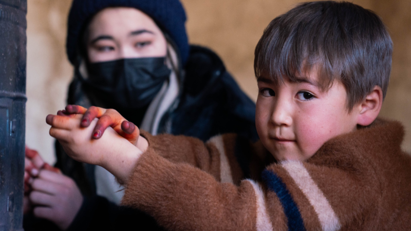 Hadi, 5, now lives in a UNHCR-constructed permanent shelter in Bamyan Province with his family. The home provides safety, stability, and protection from harsh winters, giving him a secure environment to grow and play.